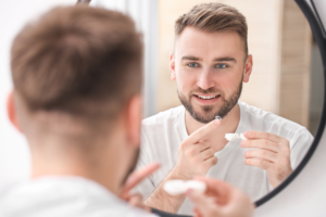 Man puts in contact lens